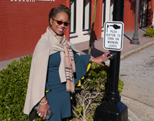 Mayor Robinson pushing crosswalk button