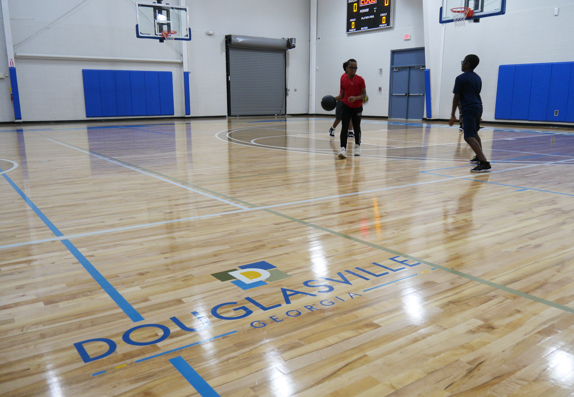 Hawthorne Center gym floor with city logo