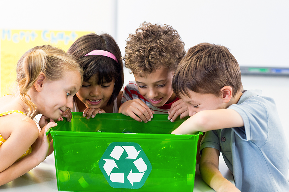 Kids recycling plastic